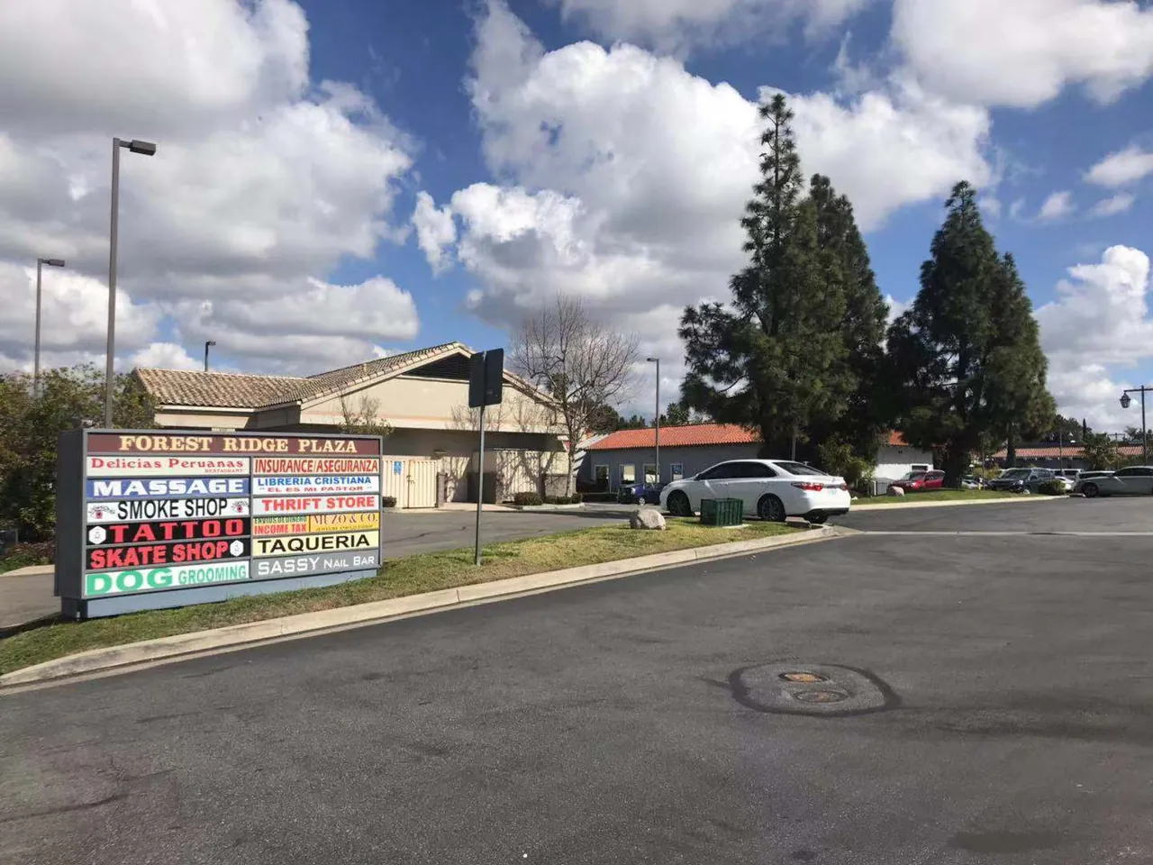 The Forest Ridge Plaza sign at Muirlands Blvd and Ridge Route Dr in Lake Forest, CA